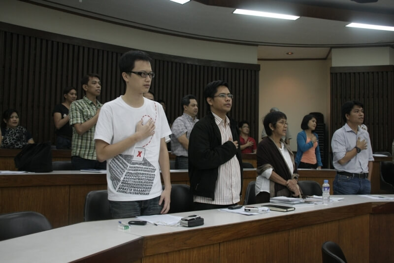 Forum participants sing the Philippine National Anthem.