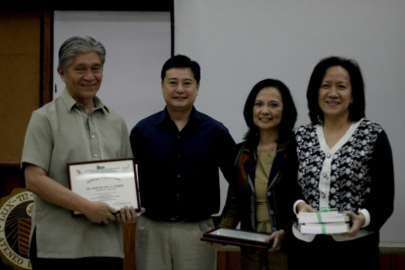 DA Representative Ed  dela Torre receives a certificate of appreciation as resource speaker during the dialogue from FSSI’s Jay Lacsamana, ISEA’s Lisa Dacanay, and Rep. Tanada’s CoS Jessica Cantos.